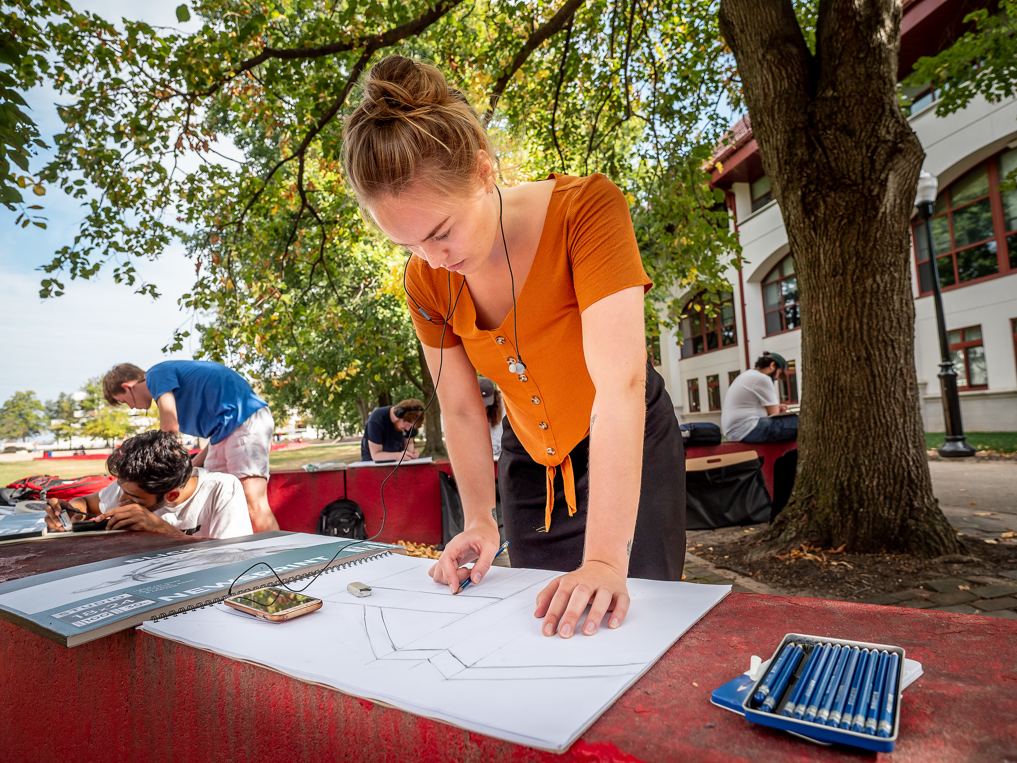 Art student drawing outside