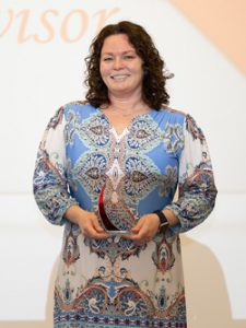 Jen Wilenta holding her award