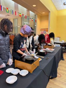 A photo of BCMSU students cooking food during a fire safety program