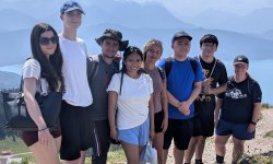group of students standing studying abroad in German at a scenic hike