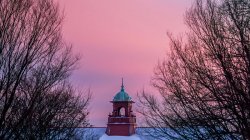 A sunset with bell tower
