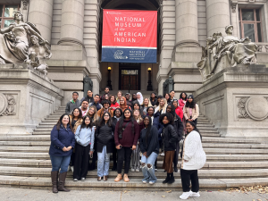 NextGen students and staff posing on the steps of a museum.