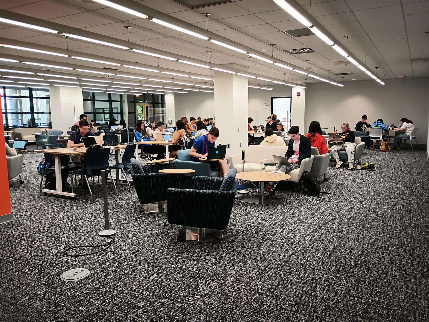 Group of high school scholars working in the commuter study space