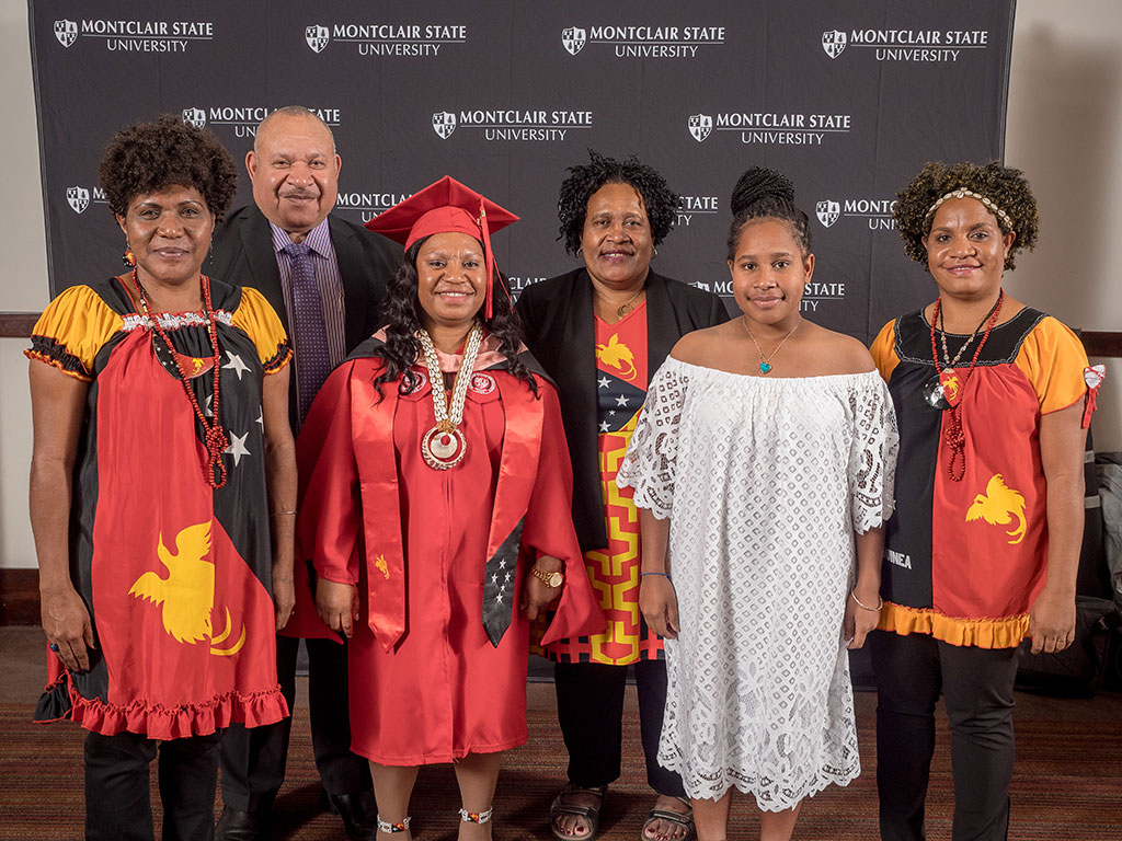 Political leaders and family traveled from Papua New Guinea to see Fulbright Scholar Rose Andrew receive a Master of Public Health. From left, front, Jennifer Makiba, Rose Andrew, Kikitani Andagali, Rhonda Andrew Kelwaip Liu; in back, Larry Libe Andagali and Janet Andagali