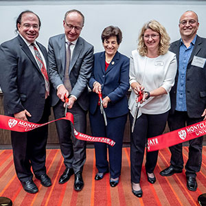 Alumnus Anthony Scriffignano ’82, ’85 MA and University board member Francis Cuss join Susan A. Cole, Lora Billings and Constantine Coutras at the opening