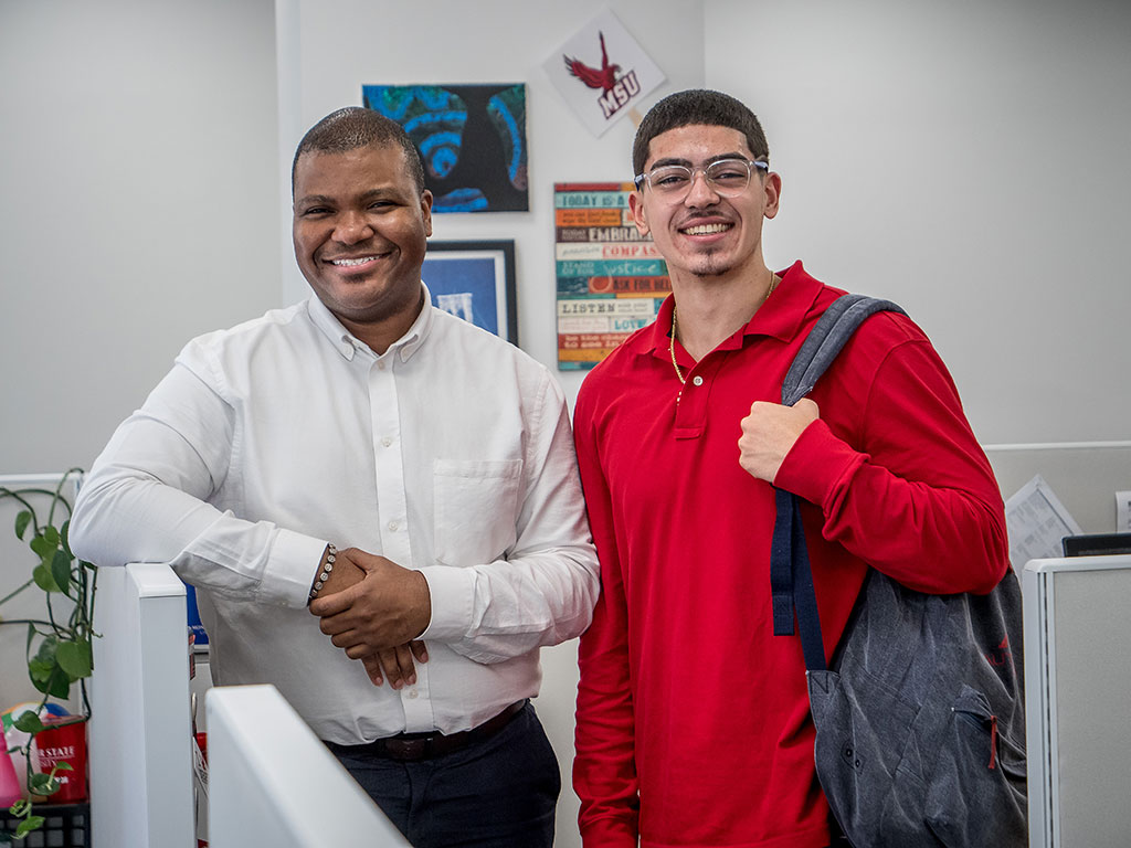 Jaffir Abdul Rice, an academic advisor at University College, helped Mario Rodriguez discover how his interests, skills and strengths connect to an academic and career path at Montclair State.