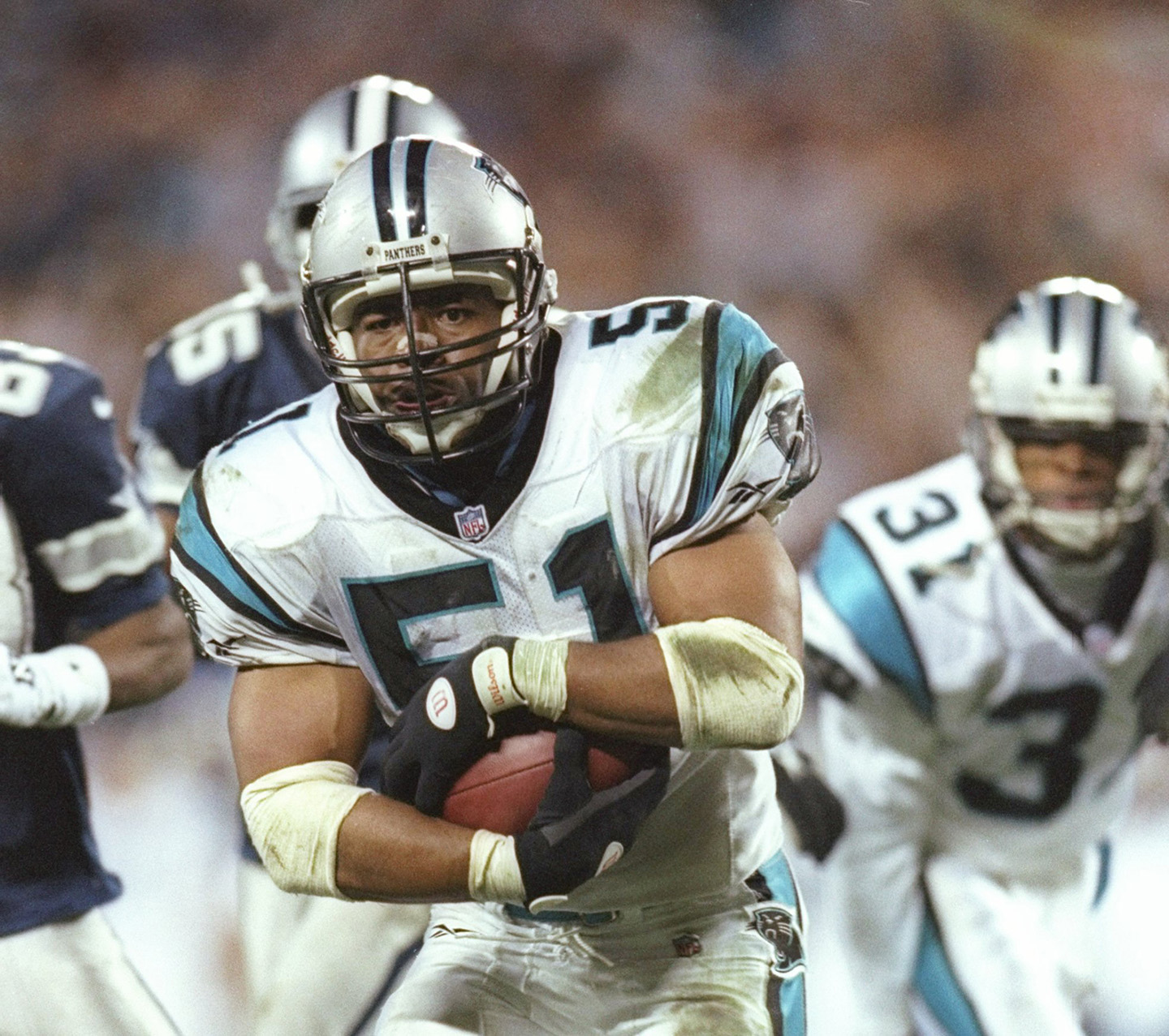 Photo of football player Sam Mills in action on the field