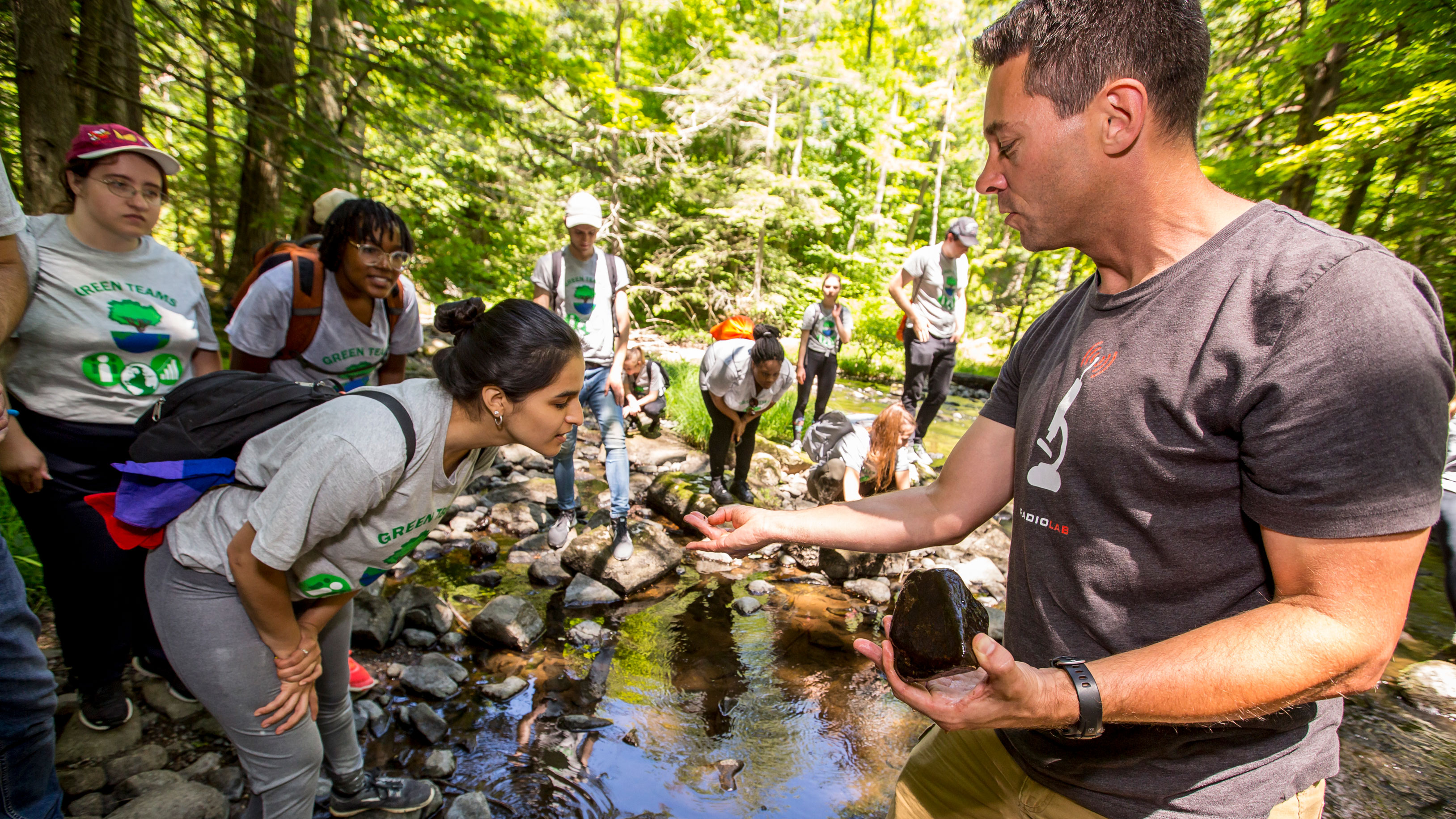 Dr. Galster showing Green Team students creature found at SOC