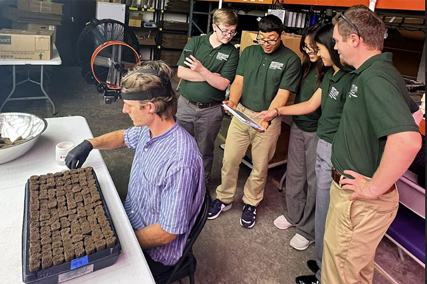 Green Team looking at soil data on tablet