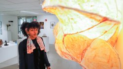 Image of student looking at artwork at Finley Gallery Exhibition