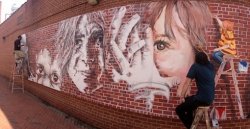 Students in the Department of Art and Design put the finishing touches on a mural in downtown Montclair to replace an earlier mural the University had gifted to the township that had been damaged during Hurricane Sandy.