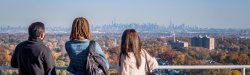 students looking over view of NYC skyline