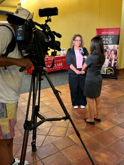 Professor Stephanie Silvera is interviewed by a TV reporter.