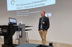 Maughn Gregory presenting at conference in Australia, October 2022