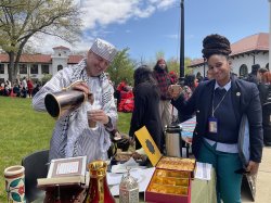 Photo of Arabic professor pouring tea at World Language Day