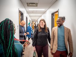 Many advisors in a hallway