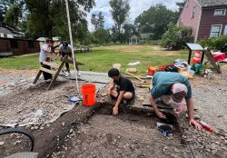 photo of students & staff on archaeology dig at Montclair History Center