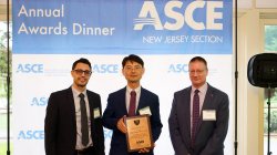 Dr. Yang Deng receiving the Educator of the Year award from ASCE-NJ