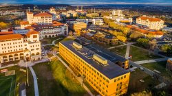 aerial photo of the north side of campus as sunset shines on buildings