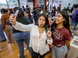 Students taking selfie at First-Gen Block Party