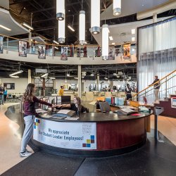 Student checking at the Student Recreation Center desk.