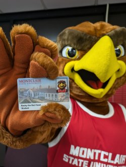 Rocky holding up his new ID Card.