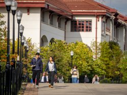 two students walking on campus.