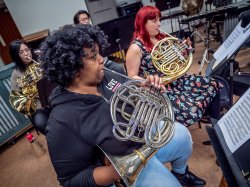 Students practice on their French horns.