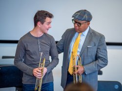 Wynton Marsalis advises a student trumpet player.