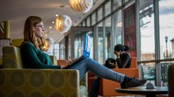 Student using laptop in Cafe Diem