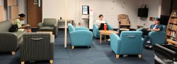 students sitting in library lounge