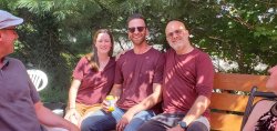 PhD candidate Geena Taite, Drs. DiNapoli and Greenstein on a bench