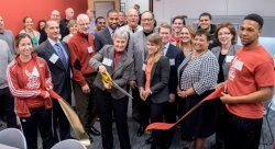 Montclair State University Director of Athletics Holly Gera cuts the ribbon to open the new Academic Center for Excellence in the Panzer Athletic Center.