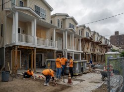 Montclair State University volunteers work together on a Habitat for Humanity home construction site in Paterson, NJ, as part of the 9/11 Day of Service and Remembrance.