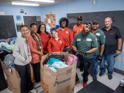 Volunteers delivering backpacks to Eastside High School in Paterson, contributing to the 9/11 Day of Service school supply donation effort.