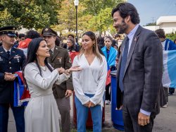 State Assemblywoman Jessica Ramirez (left) speaks with a group of people alongside Montclair State University President Jonathan Koppell (right) during the Hispanic Heritage Month launch event.