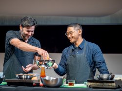 Jonathan Koppell and Josh Dela Cruz cooking