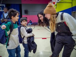 Two Montclair State University AmeriCorps members, Sophia Civitella and Ema Halilovic, play with two children at the Paterson Boys and Girls Club during the University’s 9/11 Day of Service. (Photo by John J. LaRosa)