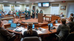 2024 student interns in the PSEG Institute for Sustainability Studies Green Teams program present their research findings on the environmental and health impacts of grass versus artificial turf to Verona city officials.