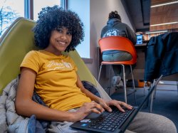 Montclair State University student studying on laptop.