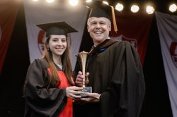 Emma Pressman received the Dean's Scholar/Artist Award from Dean Daniel Gurskis at the 2016 College of the Arts Convocation.