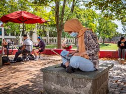 Student on campus with laptop