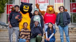 group of students with Deacon the Bear and Rocky the Red Hawk