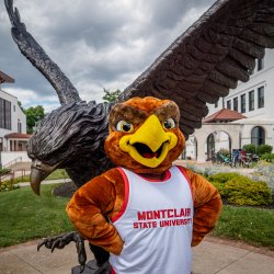 Rocky in front of the Red Hawk statue.