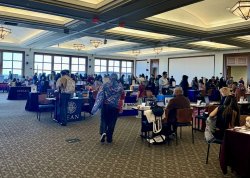 The Conference Center in University Hall is filled with students connecting with admissions representatives.