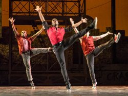 Photo of three student dancers performing in West Side Story play.