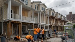 Montclair State University volunteers work together on a Habitat for Humanity home construction site in Paterson, NJ, as part of the 9/11 Day of Service and Remembrance.